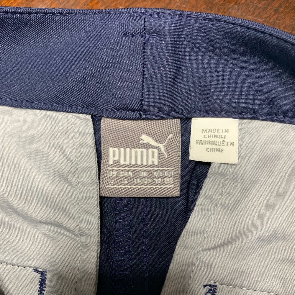 PUMA navy girls golf shorts with pockets.  YL